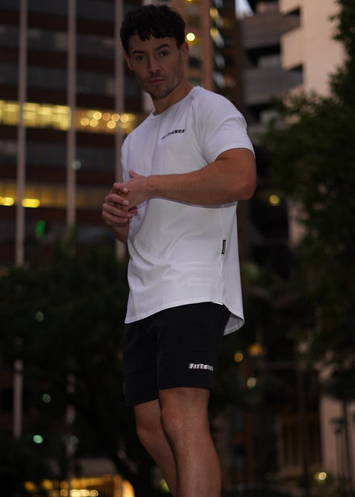 FitTrends Vibr Tee in white – clean, premium men's activewear tee built for performance and everyday wear."FitTrends Vibr Tee in white – clean, premium men's activewear tee built for performance and everyday wear.