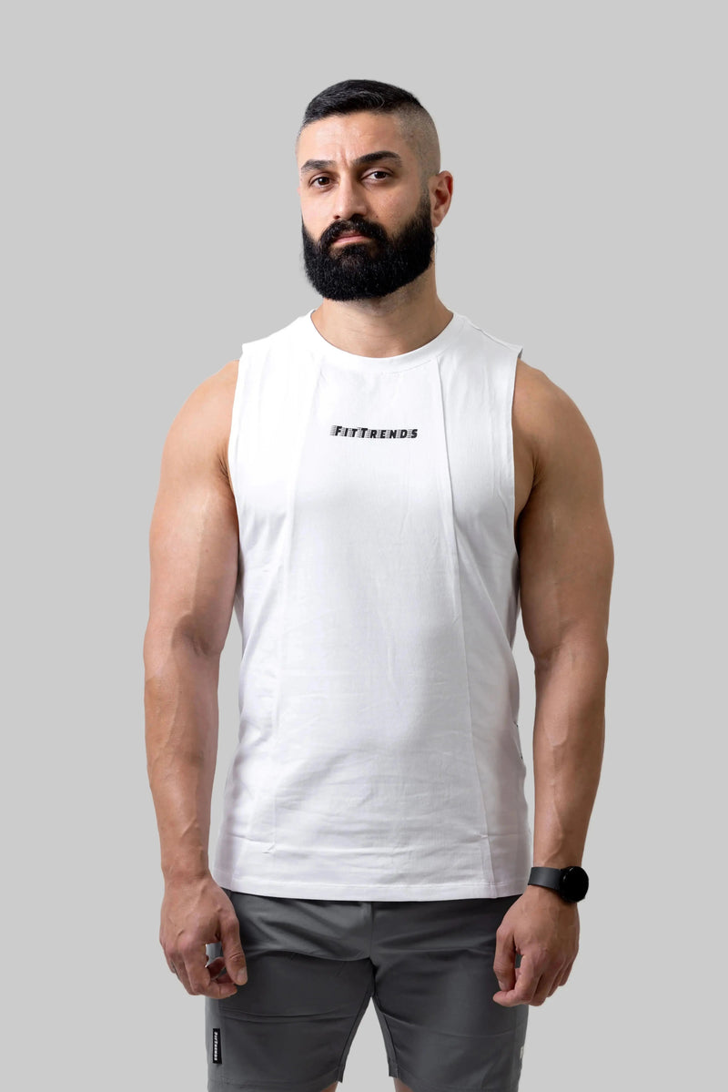 Man wearing a white sleeveless shirt with text on a plain background