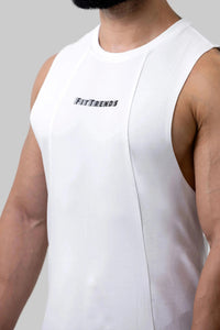 White sleeveless shirt with 'FitTrends' logo worn by a person on a light gray background