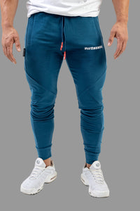 Blue jogger pants with white text on a white background