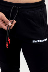 Black shorts with a brand logo on a white background