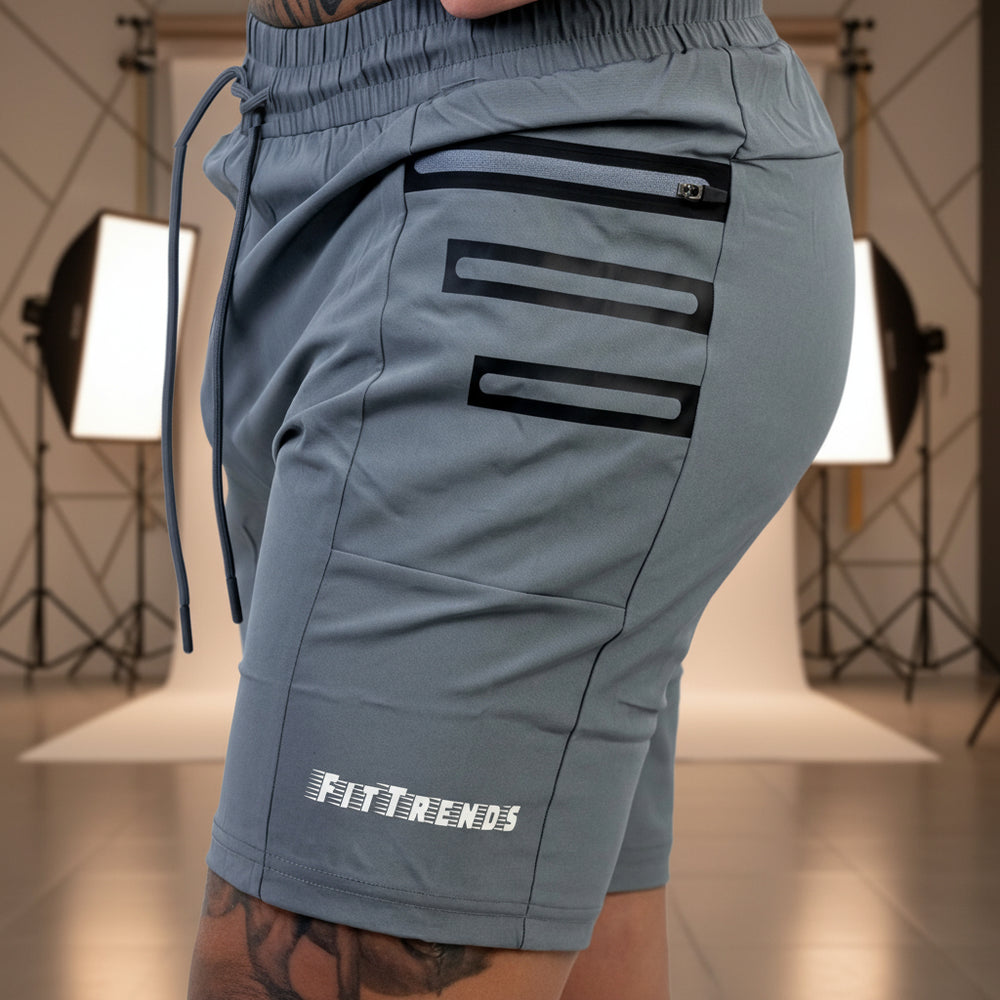 Gray athletic shorts with black accents and 'FITTRENDS' branding on a white background
