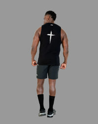 Person wearing a black sleeveless shirt with a white logo on the back, standing against a white background.