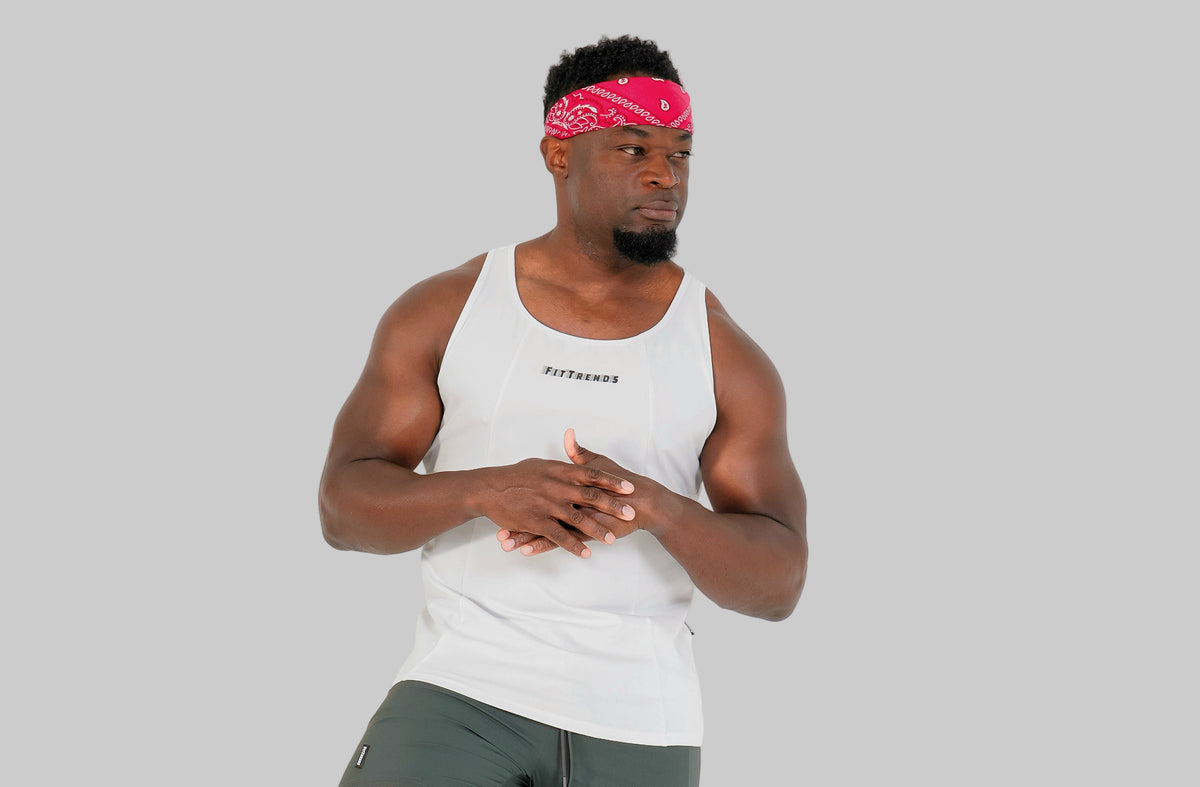 Man in athletic wear with a prosthetic leg on a white background