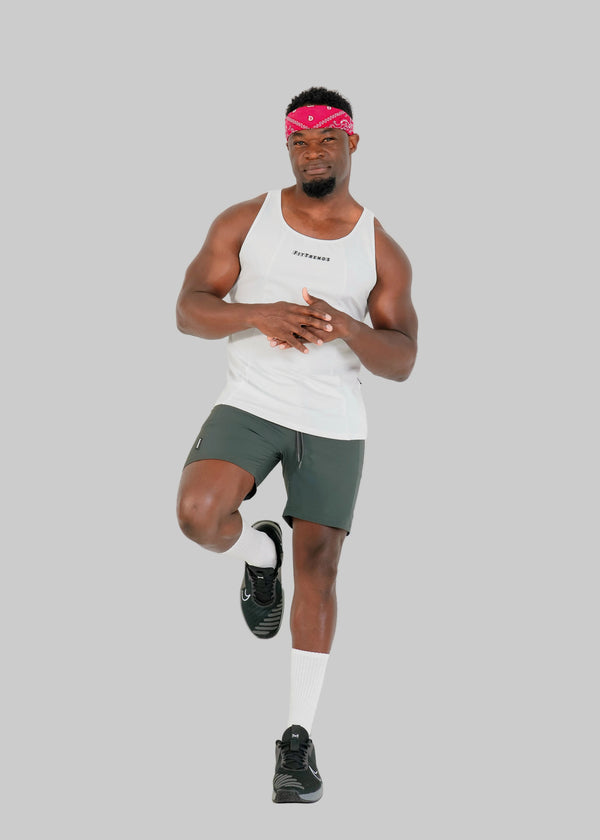 Man in athletic wear posing on a white background