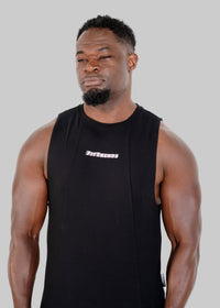 Man wearing a black sleeveless shirt with a logo on a white background