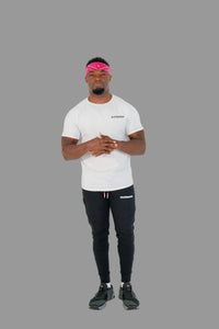 Person wearing a white t-shirt and black pants with visible branding on a white background