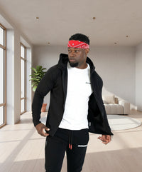 Man wearing a black jacket, white shirt, and black pants with a red bandana on a white background