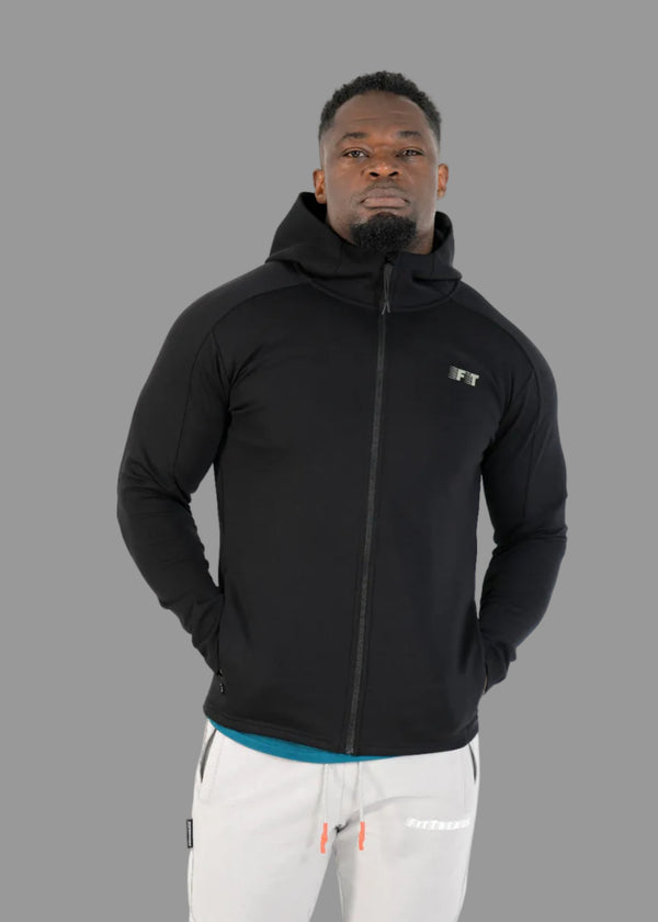 Man wearing a black hoodie with a brand logo on a white background