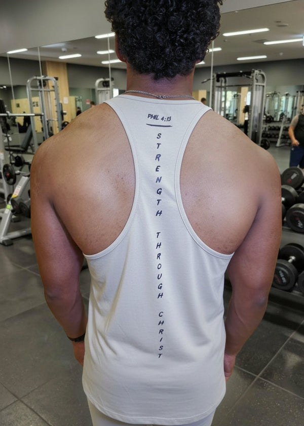 Person wearing a white tank top with text in a gym setting