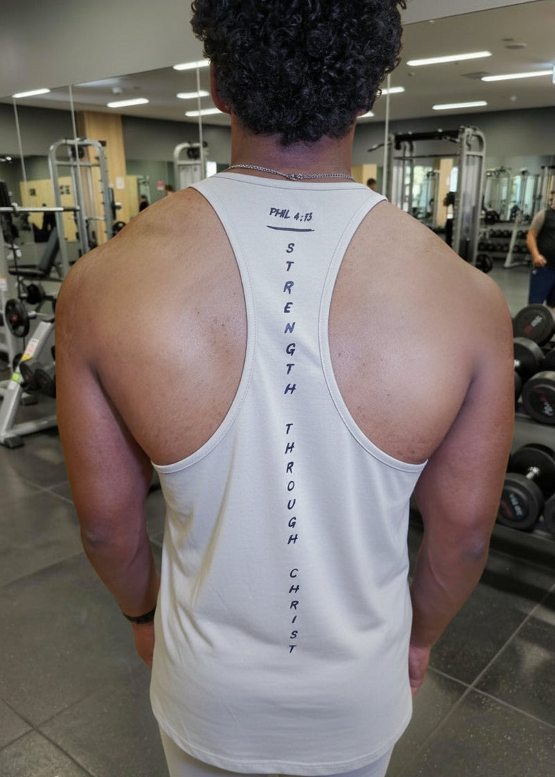 Person wearing a white tank top with text in a gym setting
