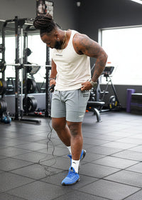 Person exercising with resistance bands on a grassy field